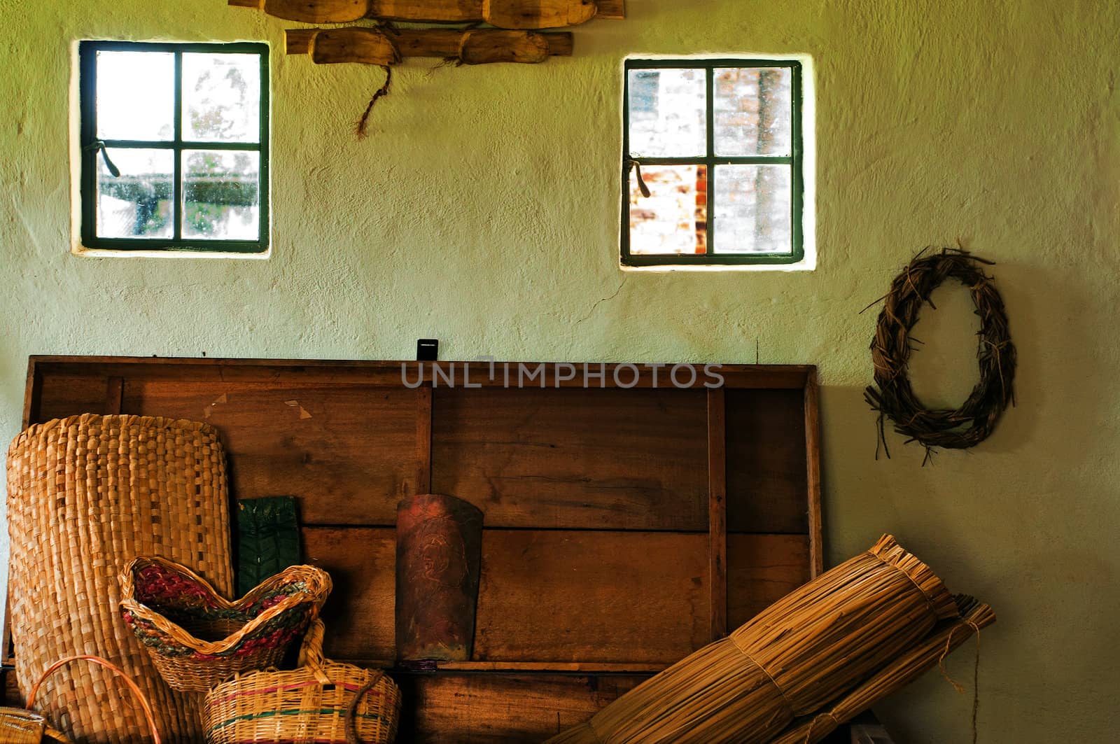 An interior shot of a colonial with wicker baskets and other decoration.