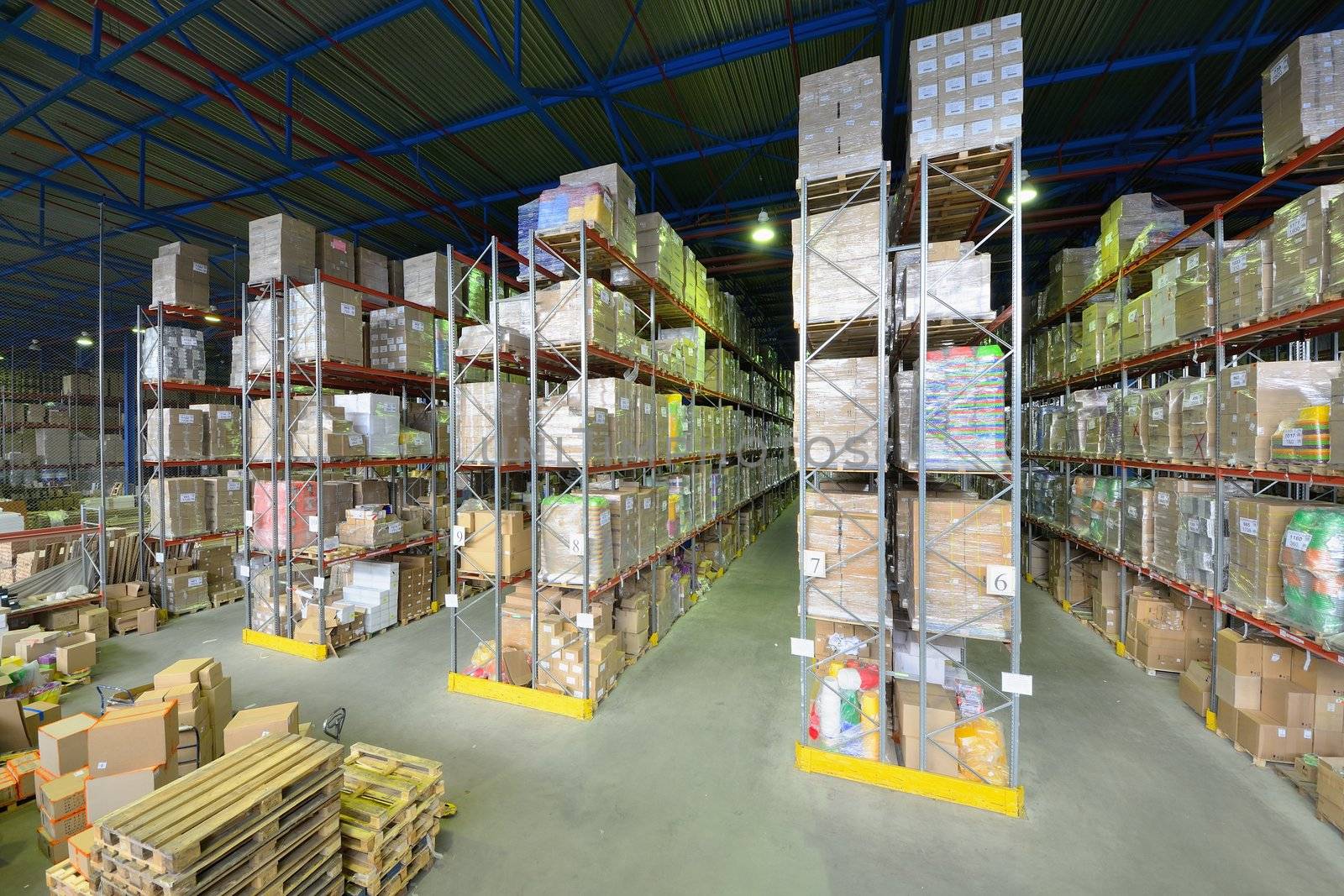 Indoor warehouse with lot of pallet. Wide angle photo.