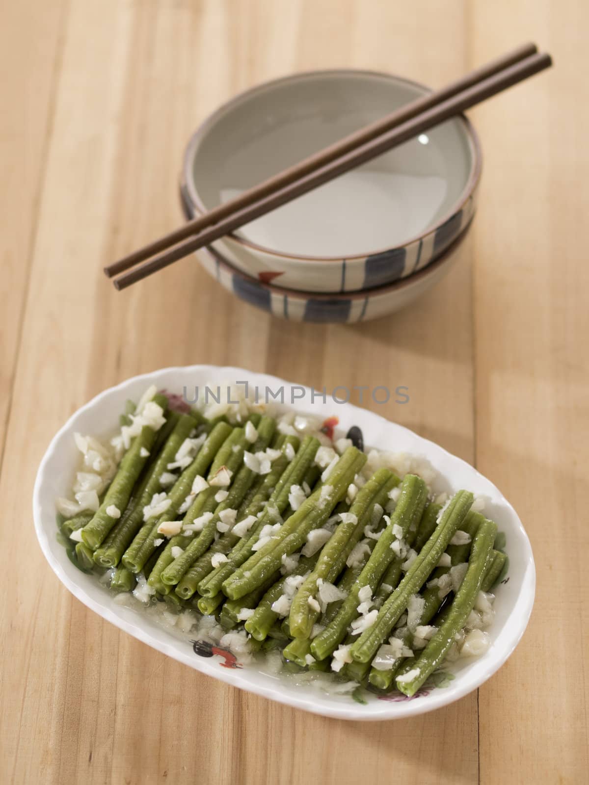 close up of a plate of stir fried long beans