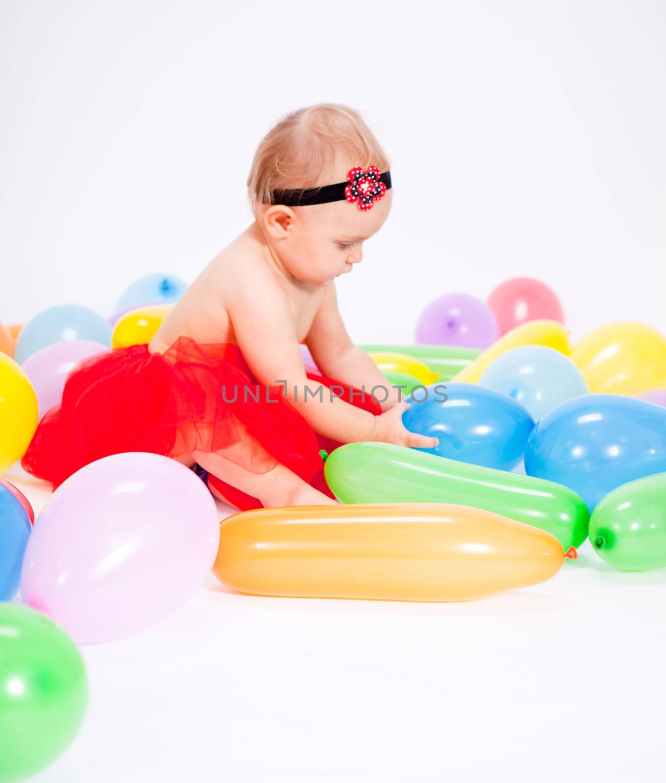 cute little baby child with colorfull balloons birthday celebration