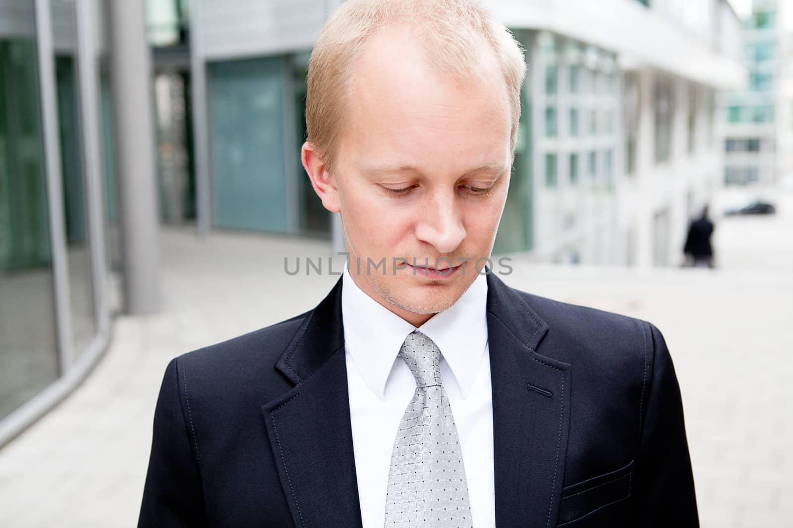 succsessful business man with tie and black dress reading newspaper