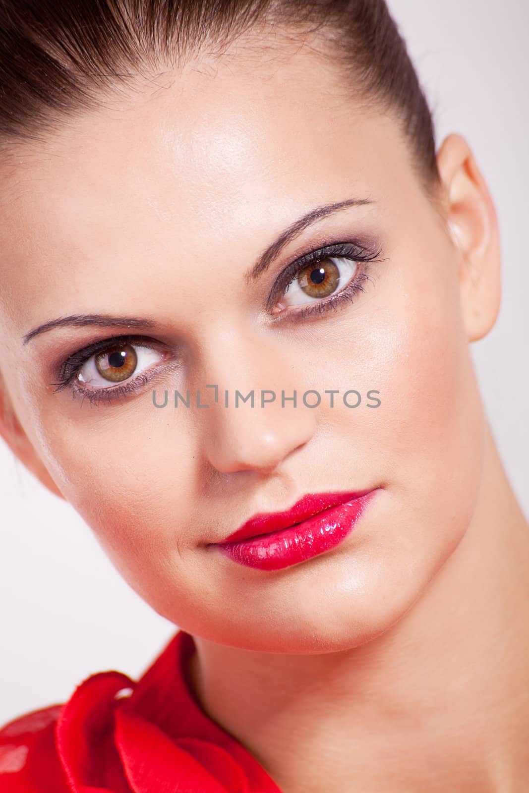 beautiful brunette woman with red lips and red shirt
