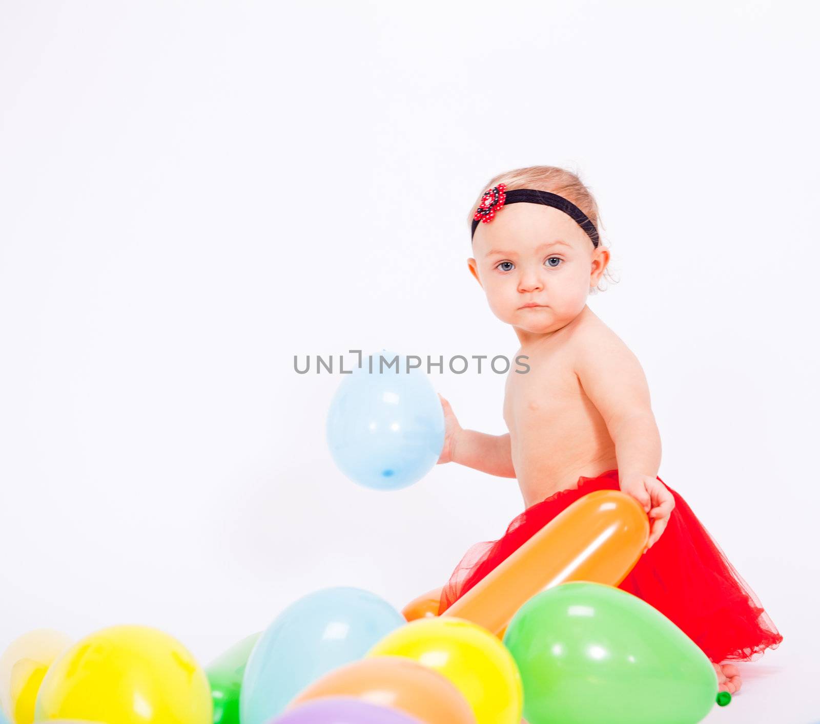 cute little baby child with colorfull balloons birthday celebration
