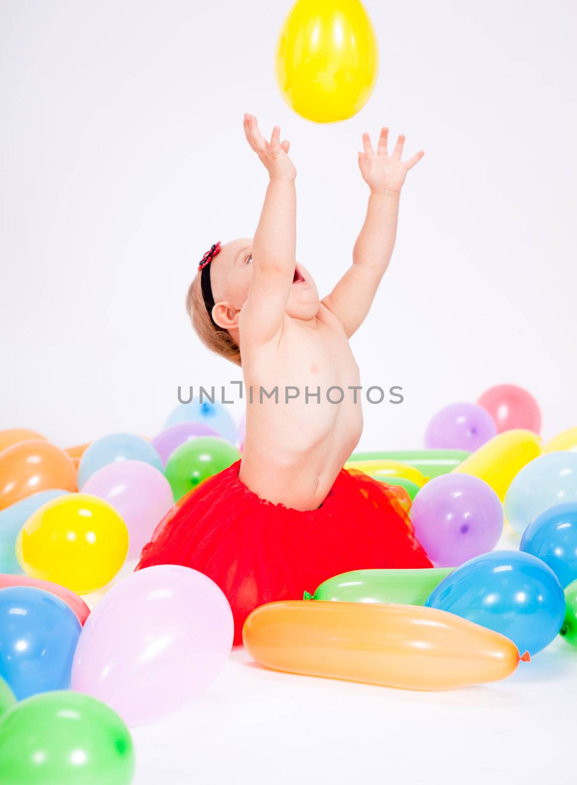 cute little baby child with colorfull balloons birthday celebration