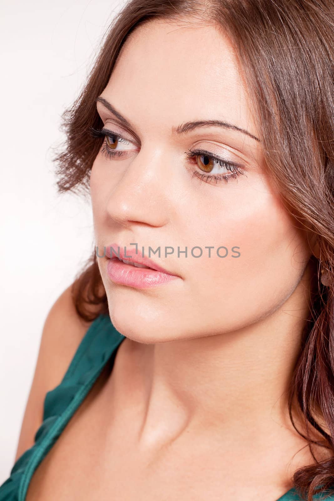 beautiful brunette woman portrait with makeup and brown eyes