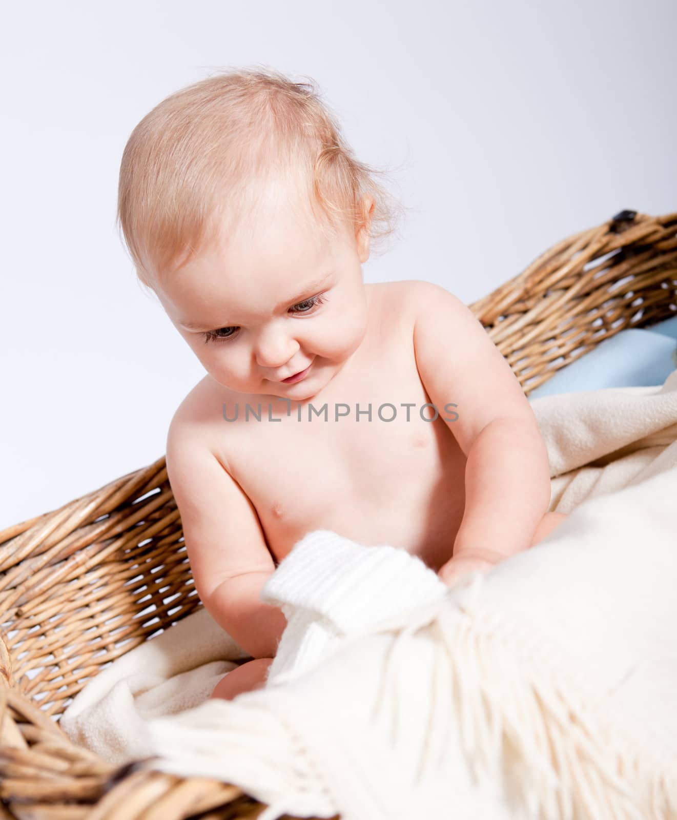 cute little baby infant in basket with white teddy bear