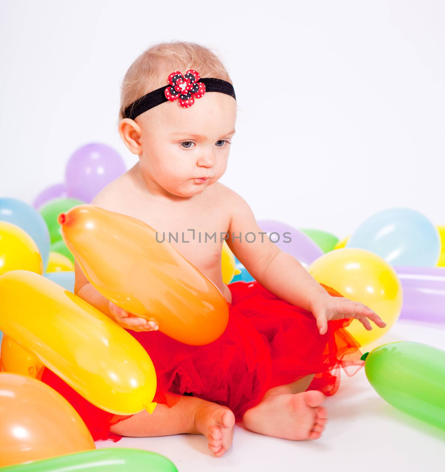 cute little baby child with colorfull balloons birthday celebration