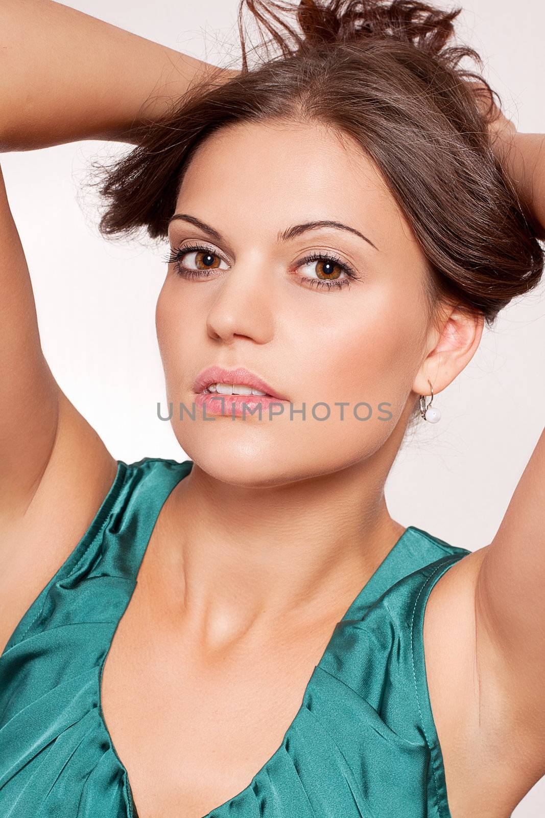 beautiful brunette woman portrait with makeup and brown eyes