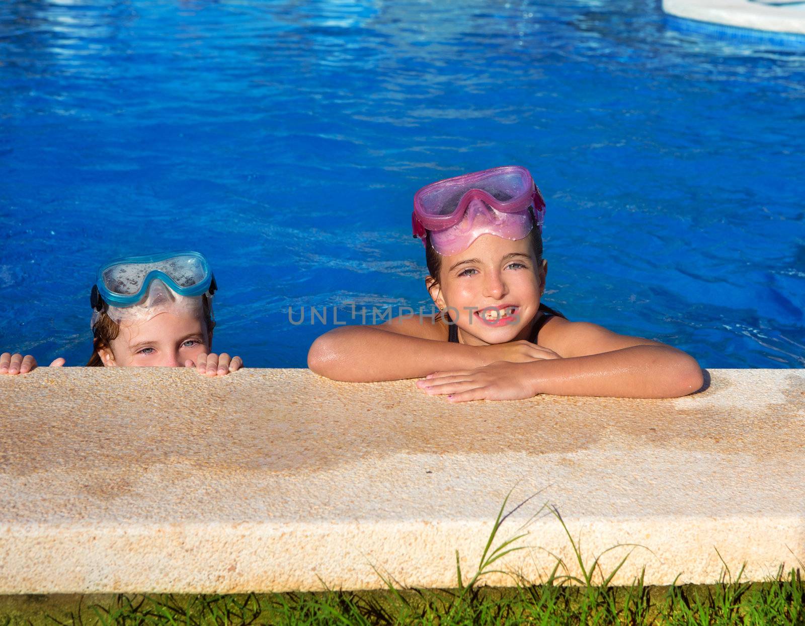 Blue eyes children girls on on blue pool poolside smiling by lunamarina