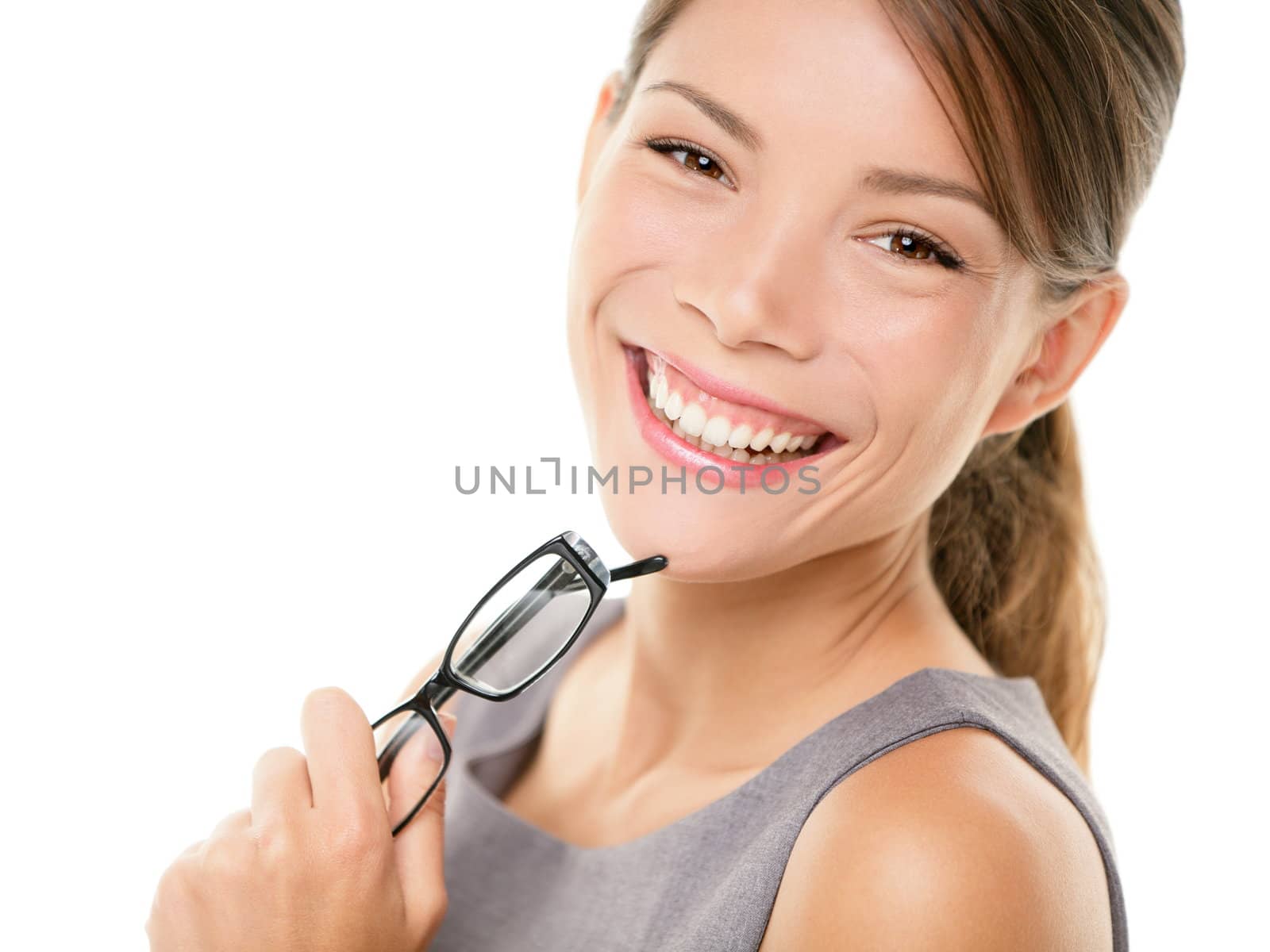 Young asian business woman portrait. Young professional woman smiling looking at camera holding eyewear glasses. Beautiful young mixed race Asian Chinese / Caucasian businesswoman isolated on white background.