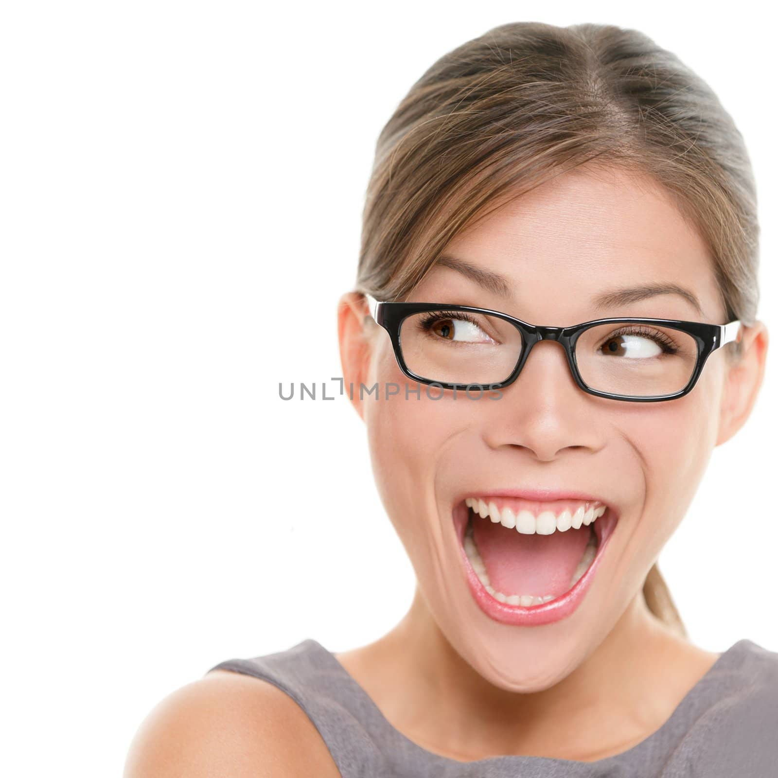 Excited woman looking sideways screaming of joy. Closeup of happy mixed race Asian Chinese / Caucasian female business woman isolated on white background.