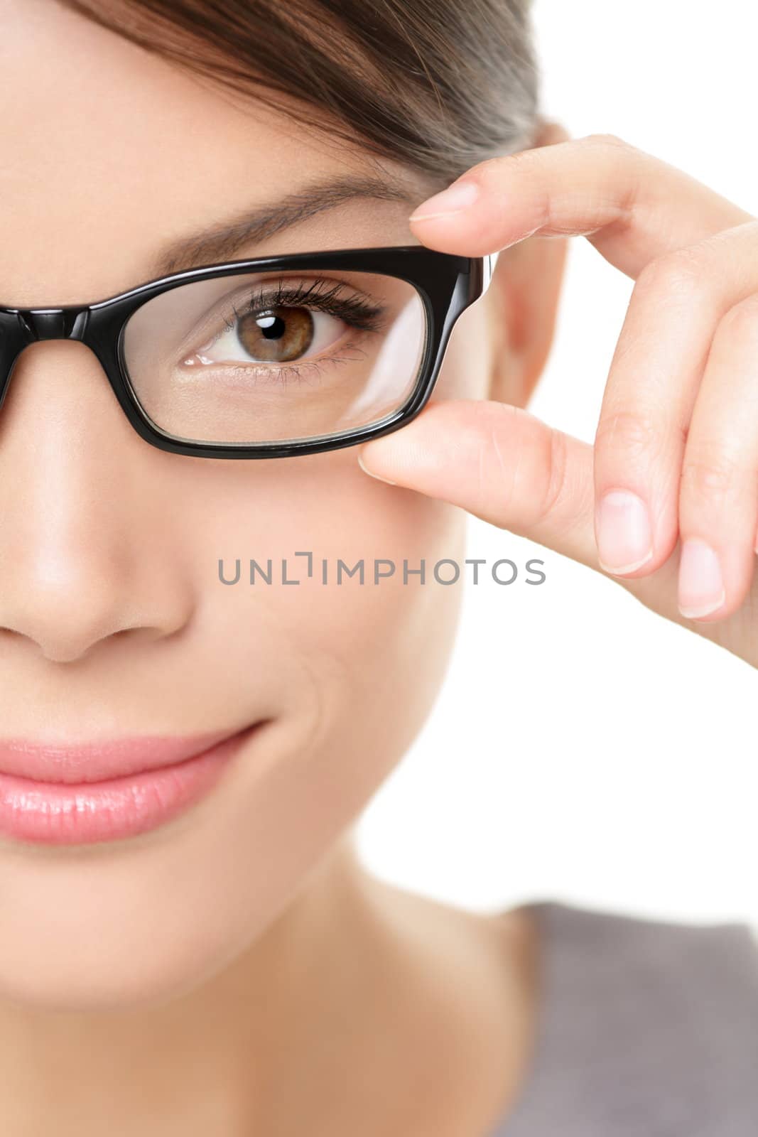 Eyewear glasses woman closeup portrait. Woman wearing glasses holding frame in close-up. Beautiful young mixed race Caucasian / Asian Chinese female model on white background.