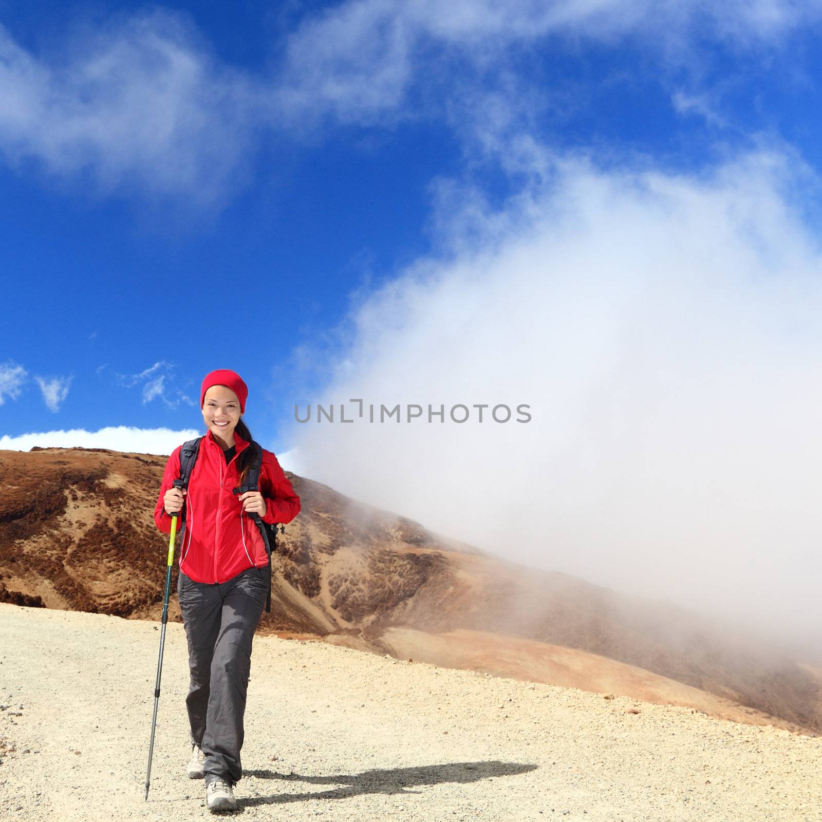 Hiker woman hiking on mountain.