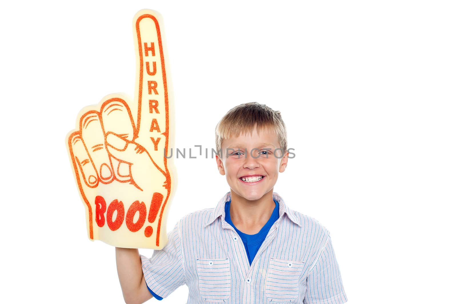 Handsome boy with a hurray boo foam hand pointing skywards on isolated white background