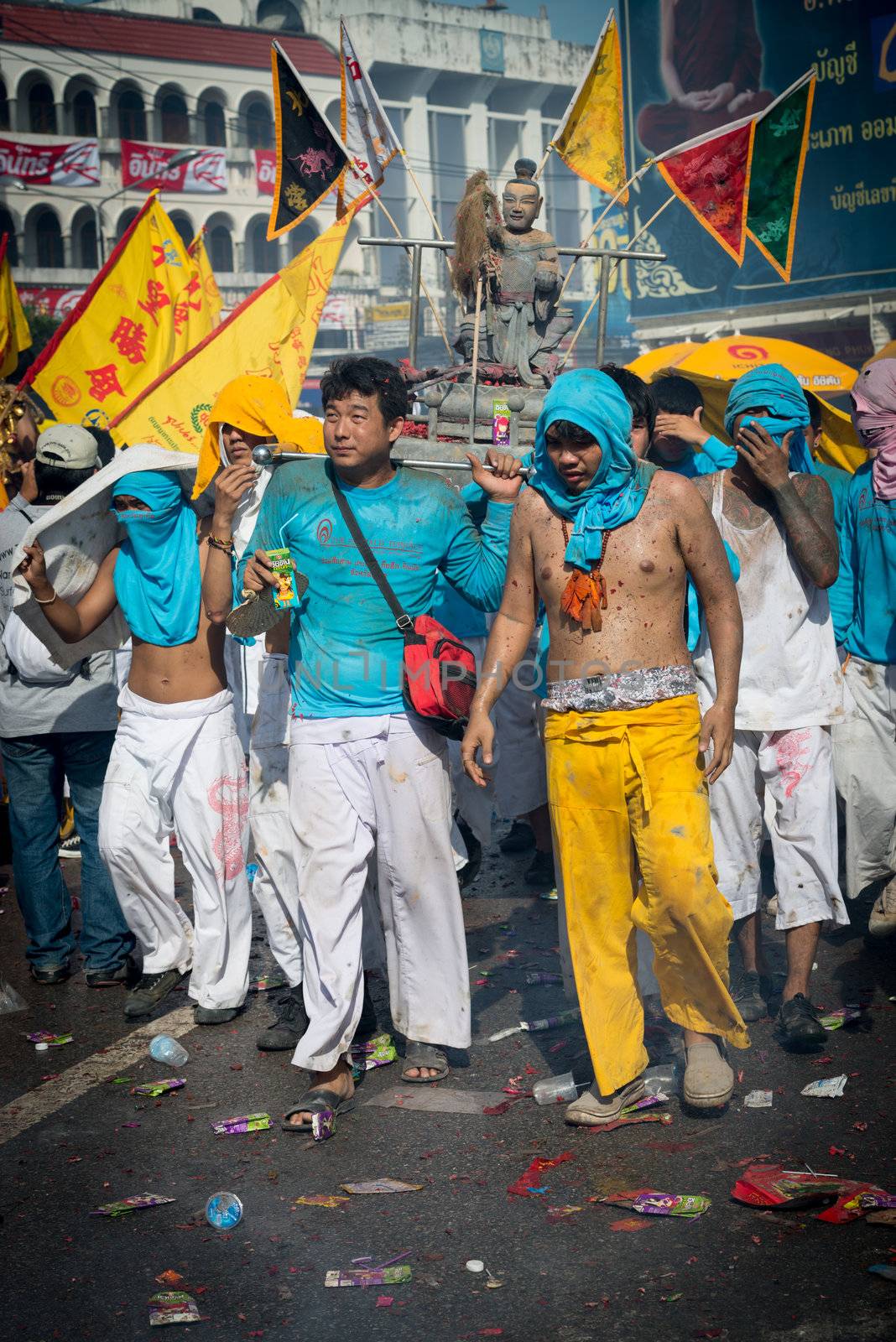Phuket, Thailand - October 21, 2012: An unidentified people on street processions of Phuket Vegetarian Festival. It is an annual event held during the ninth lunar month of the Chinese calendar. 