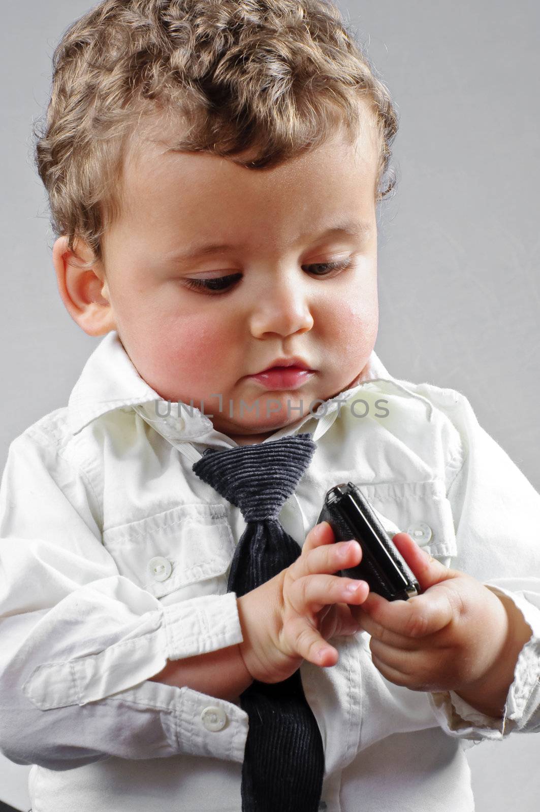 beautiful blond boy dressed businessman