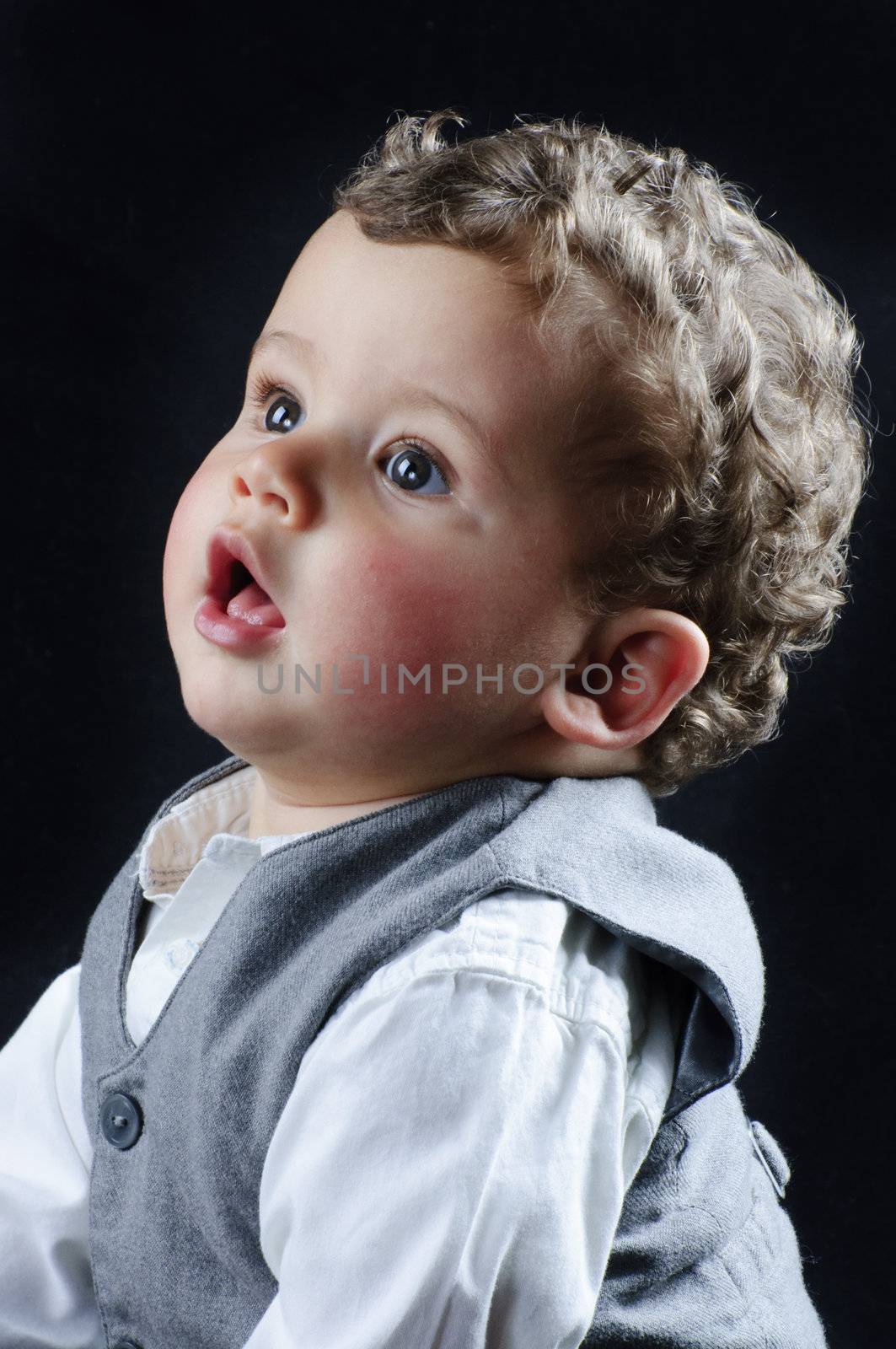 beautiful blond boy dressed businessman with funny face