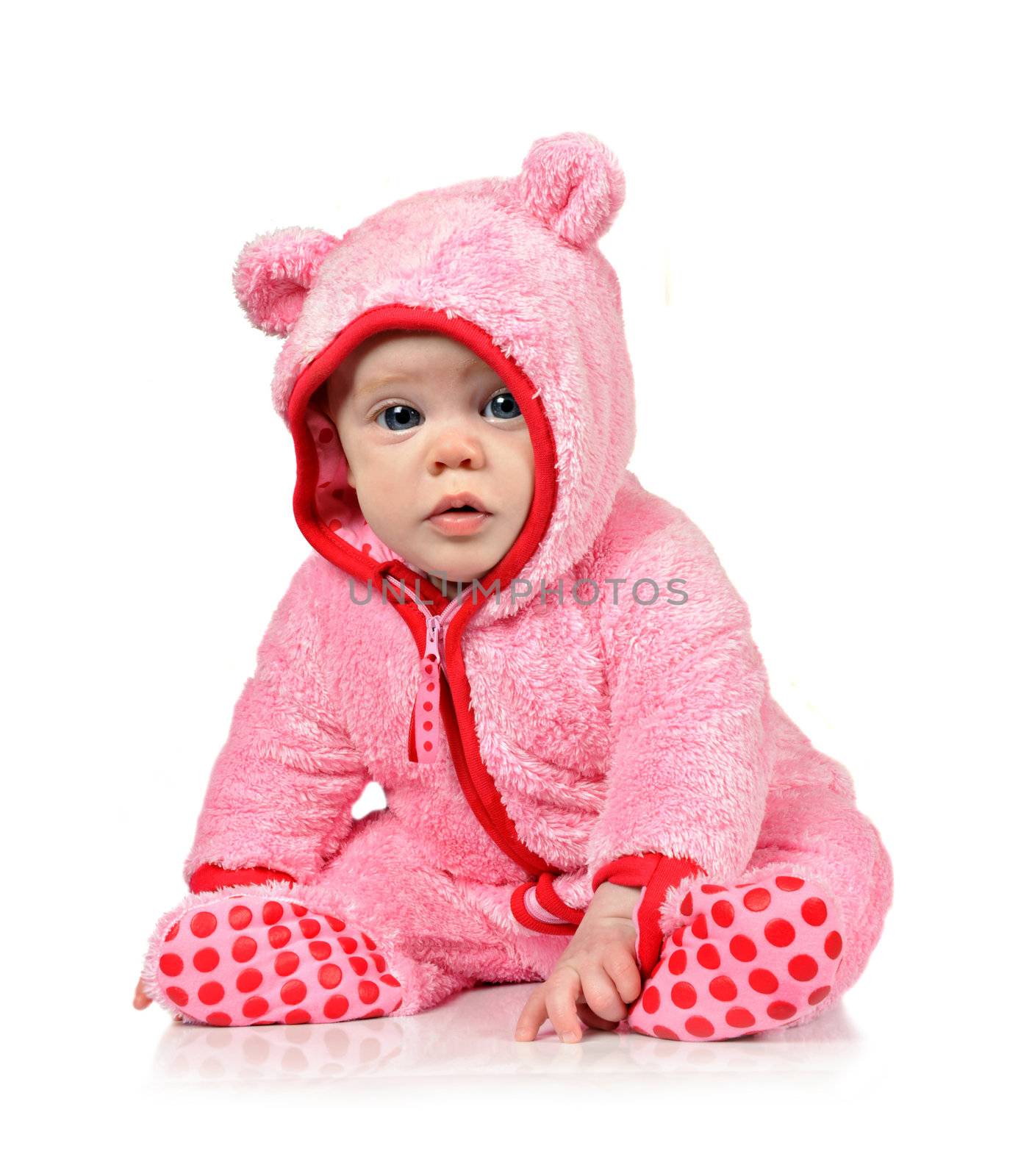 Cute little baby girl in fun clothes on a white background
