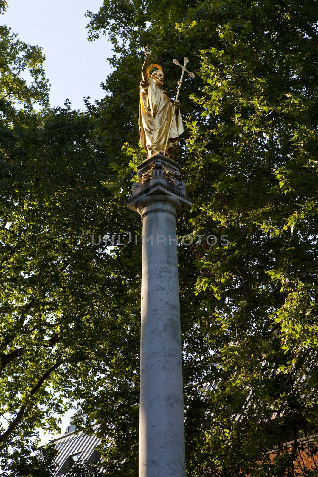 The guilded statue of St. Paul in the churchyard of St. Paul's Cathedral in London.