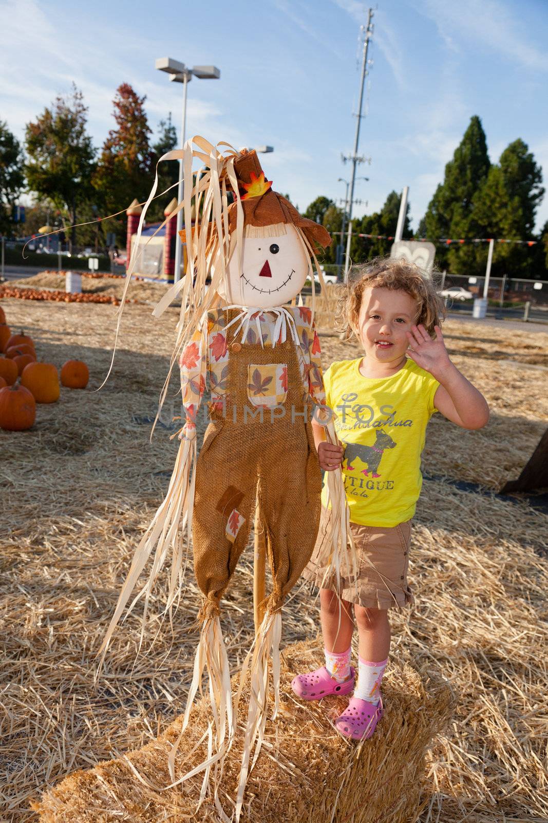 Having fun on pumpkin patch on sunny Sunday.