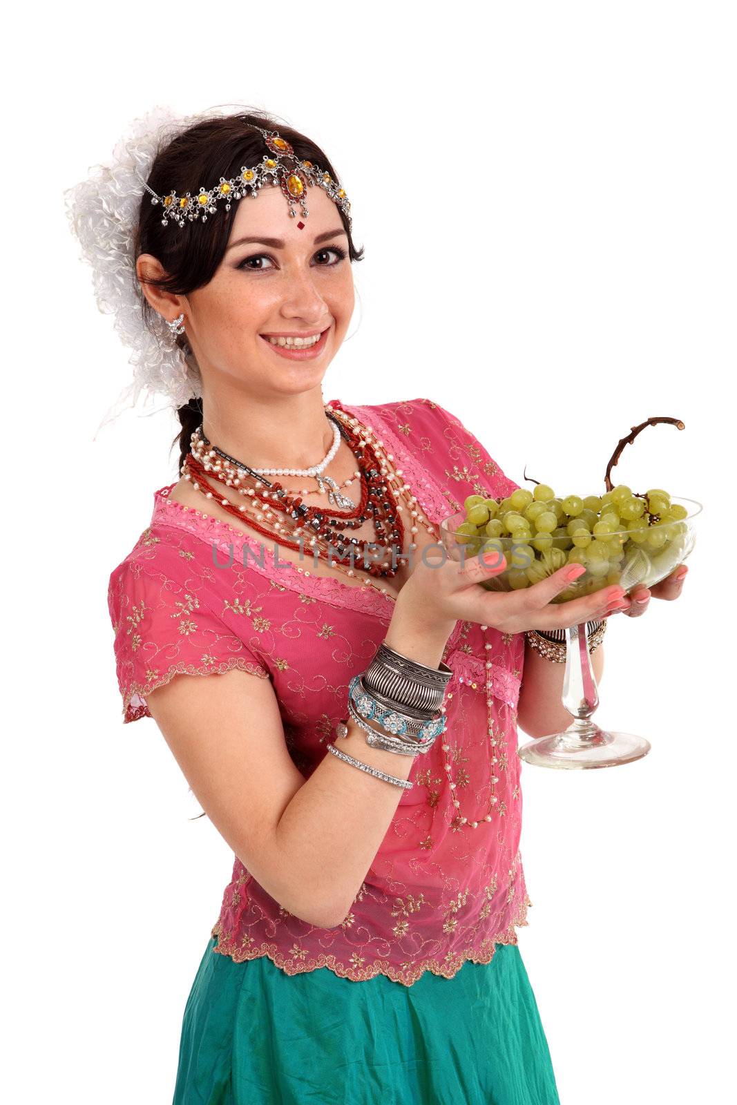 Young girl in the Indian national dress with grapes
