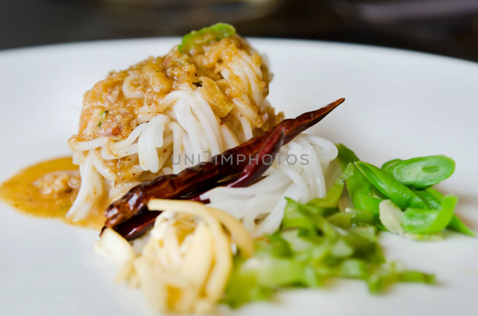  rice vermicelli eaten with sweet sauce and vegetable ,