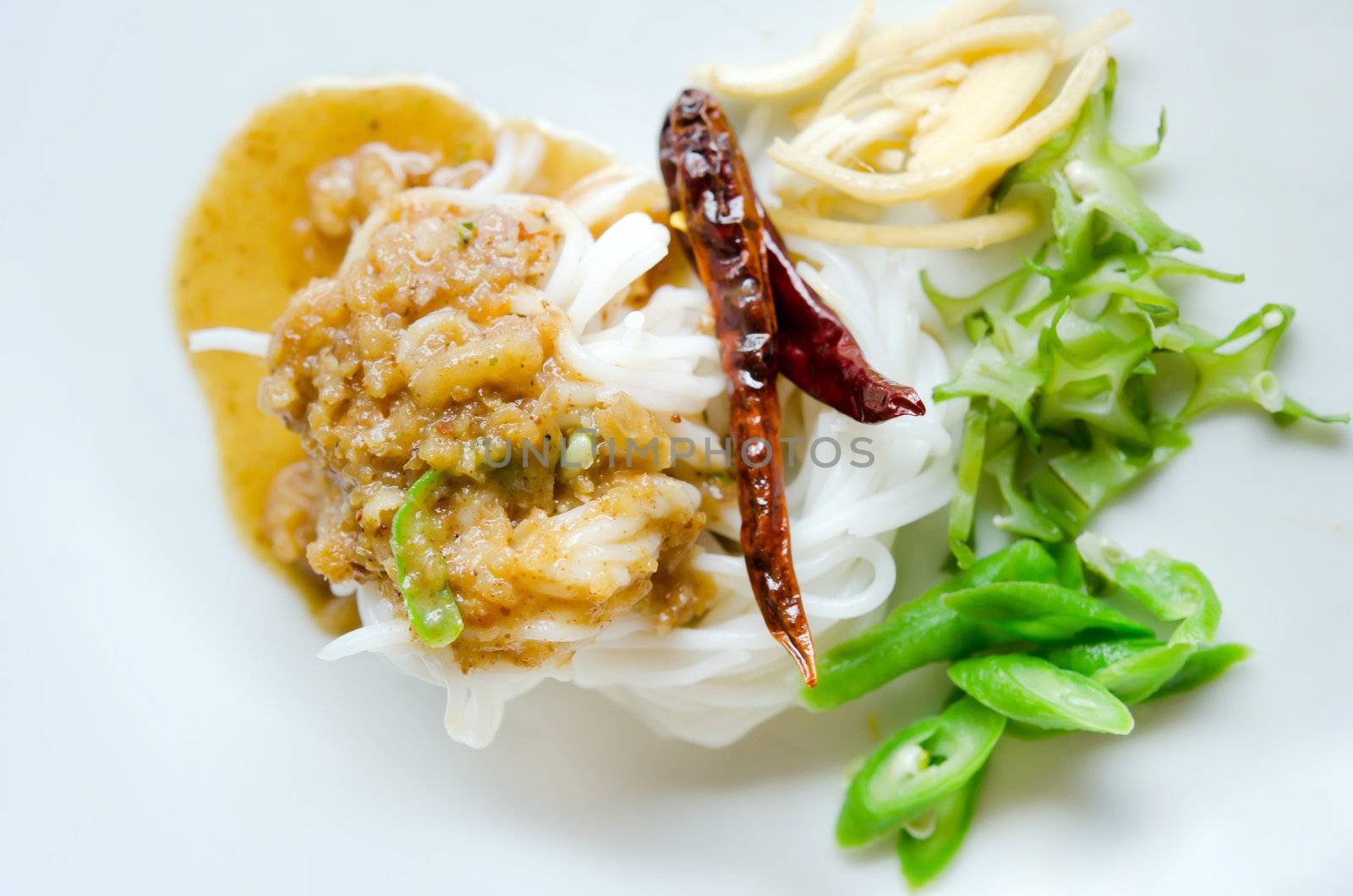  rice vermicelli eaten with sweet sauce and vegetable ,