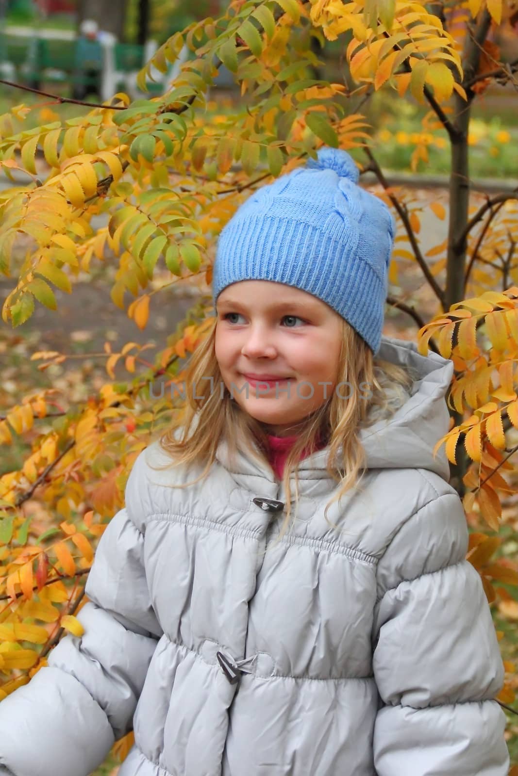 Portrait of beautiful girl with blond hair and blue eyes