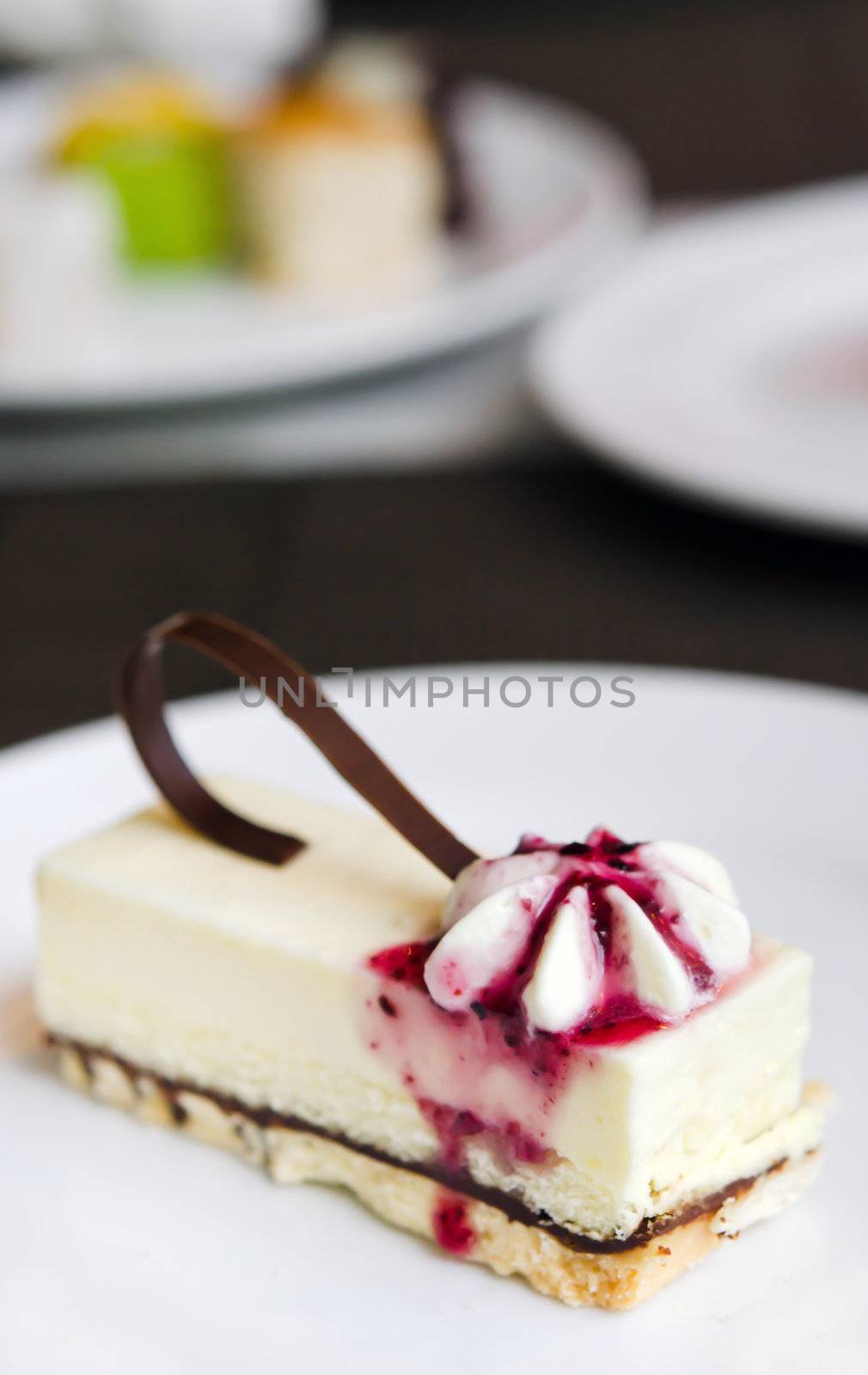 blueberries cheese cake on white plate