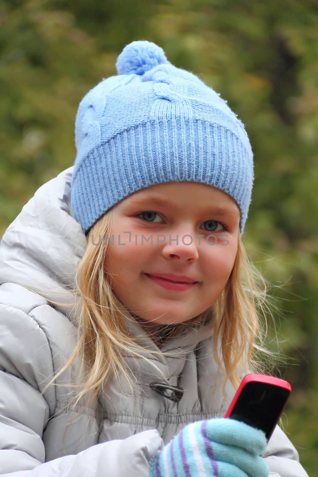 Portrait of small girl with cellular phone