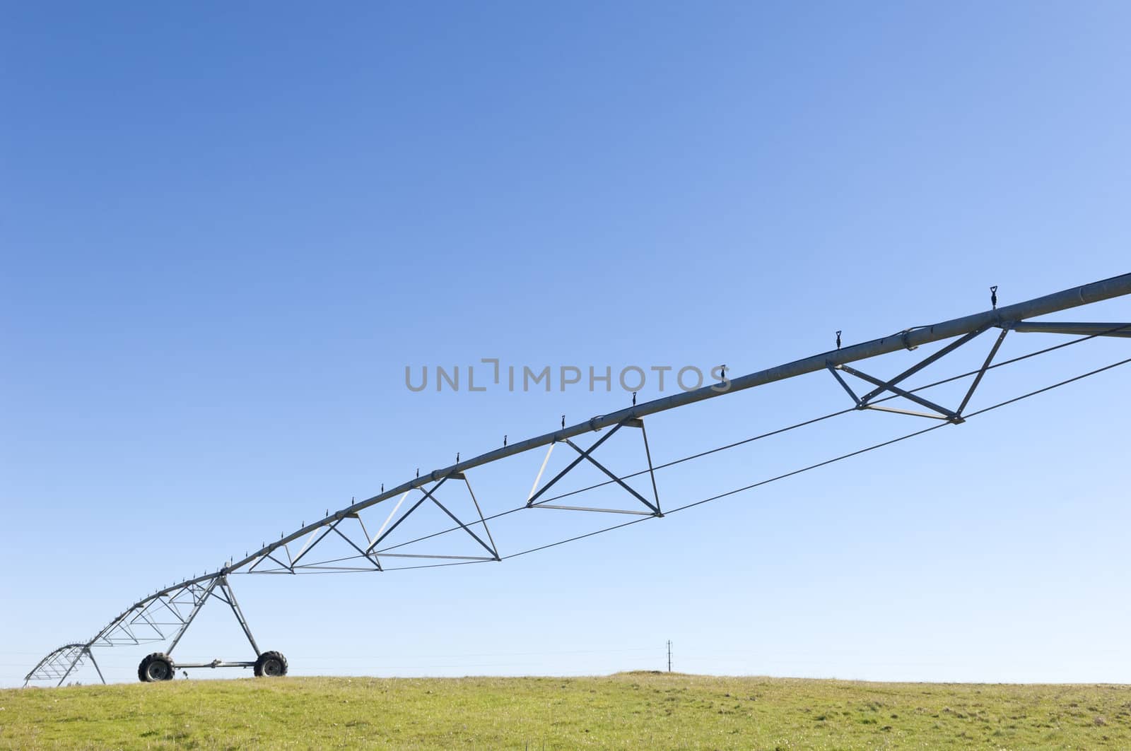 Irrigation pivot resting in a grass field of Alentejo, Portugal