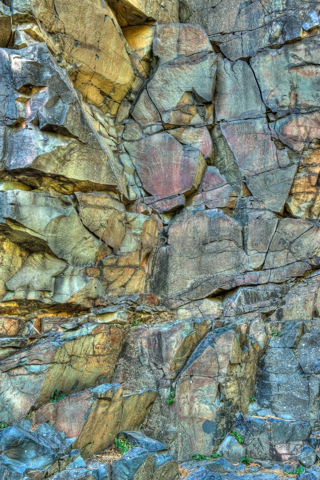 Wall of Bassalt Rock With Cracks by pixelsnap