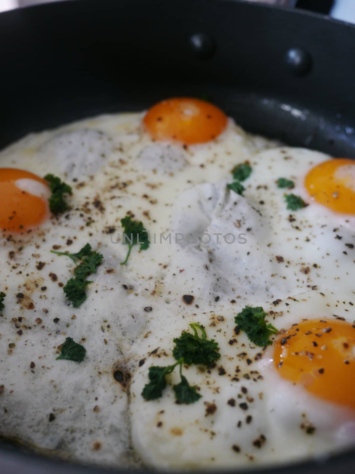 Fried egg on black pen. close up