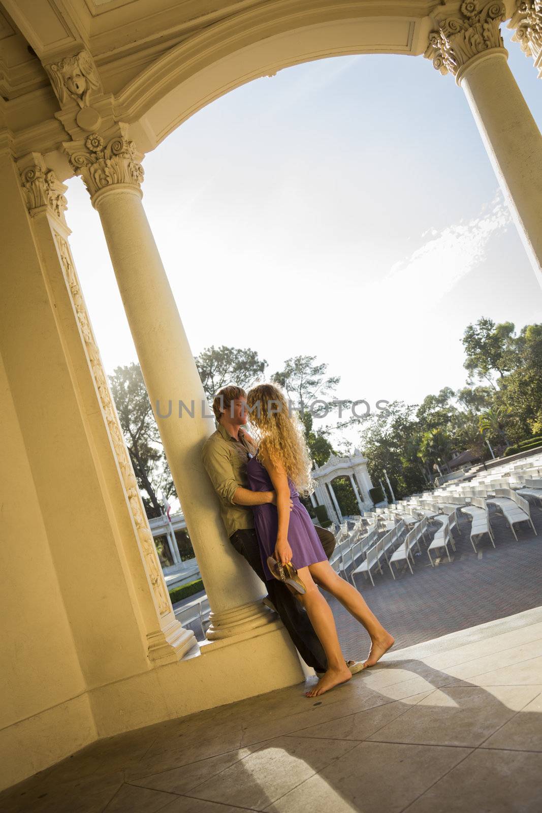 Attractive Playful Loving Couple Portrait in the Outdoor Amphitheater.