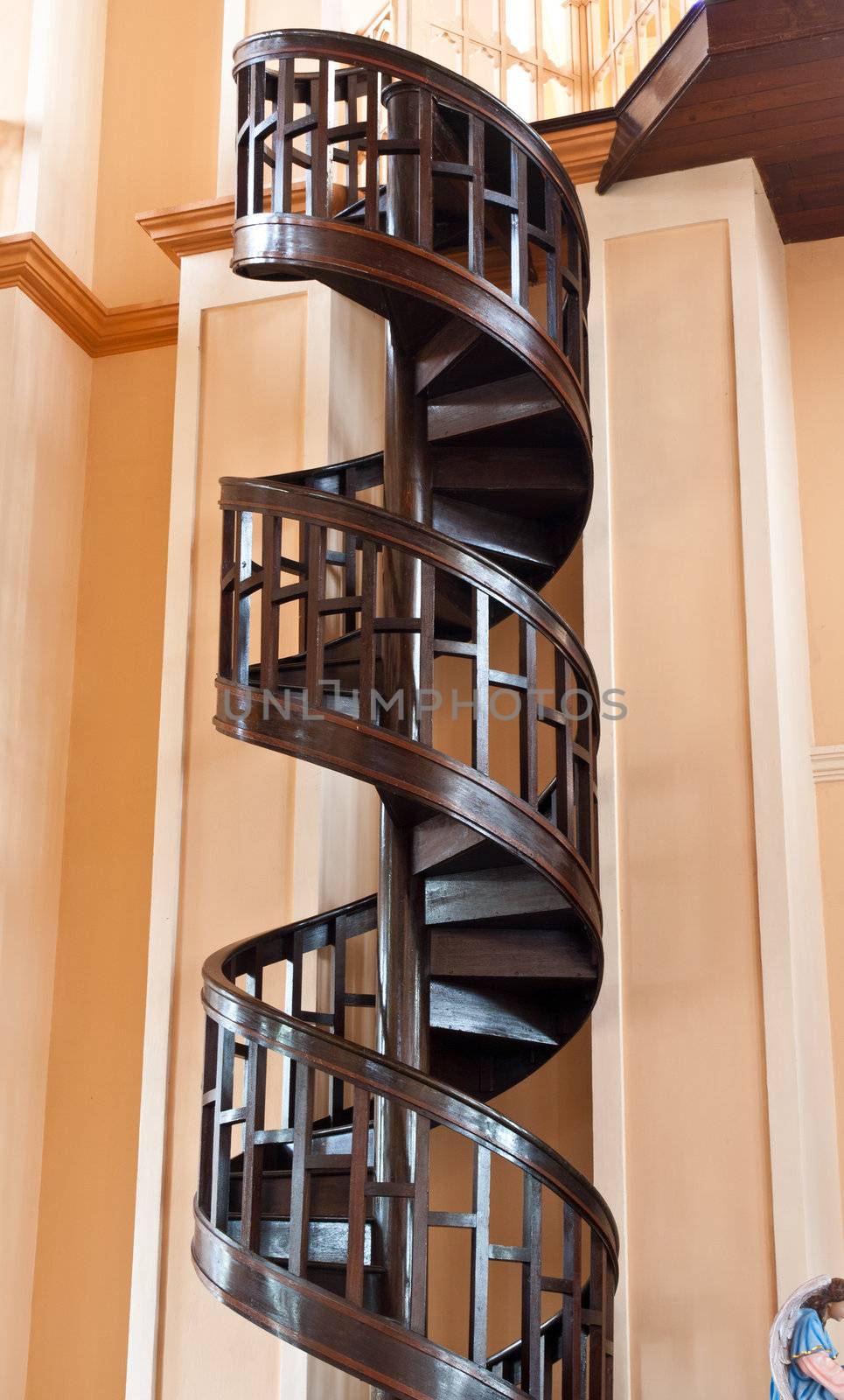 Spiral staircase made of wood in church Chanthaburi, Thailand.