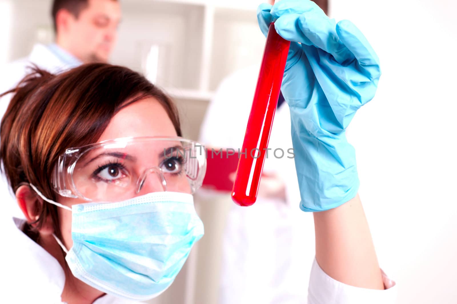 chemist working in the laboratory, mix liquid