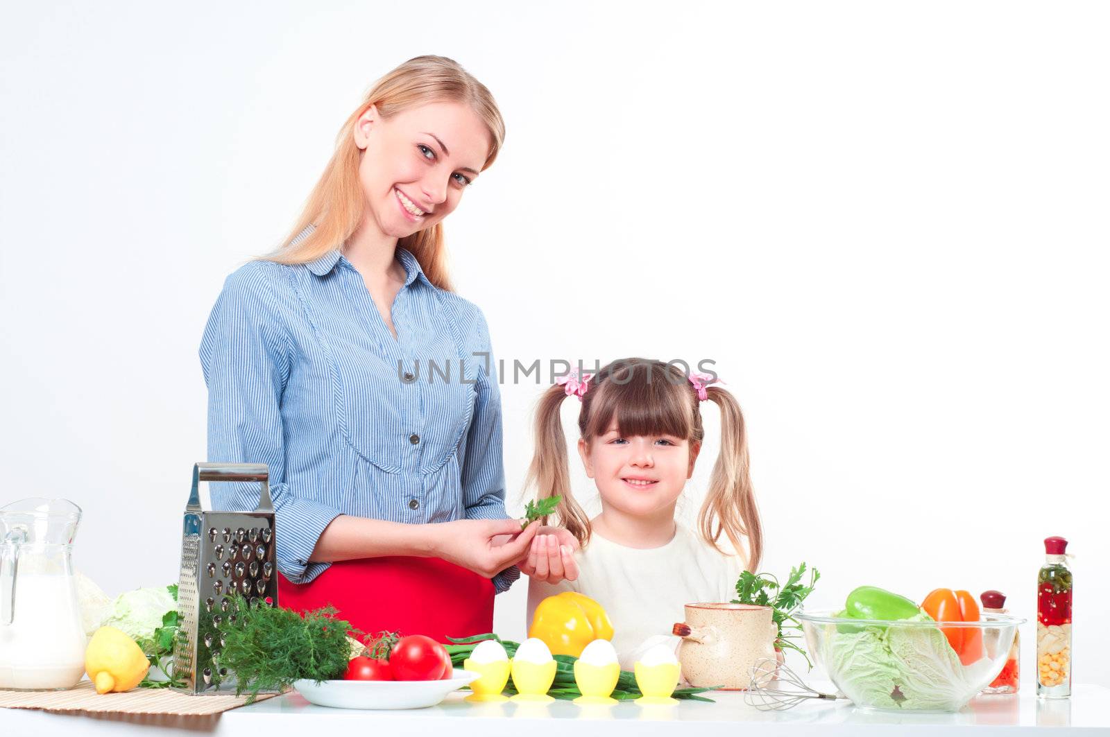 Mother and daughter cooking together, help children to parents