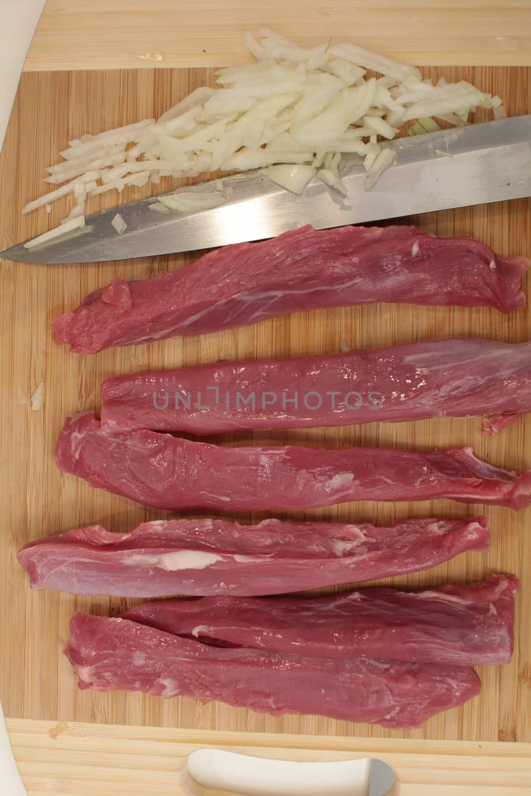 raw lamb on a wooden surface table