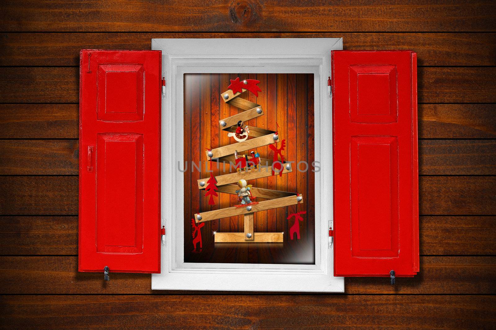 Christmas tree seen through a wooden window with red shutters
