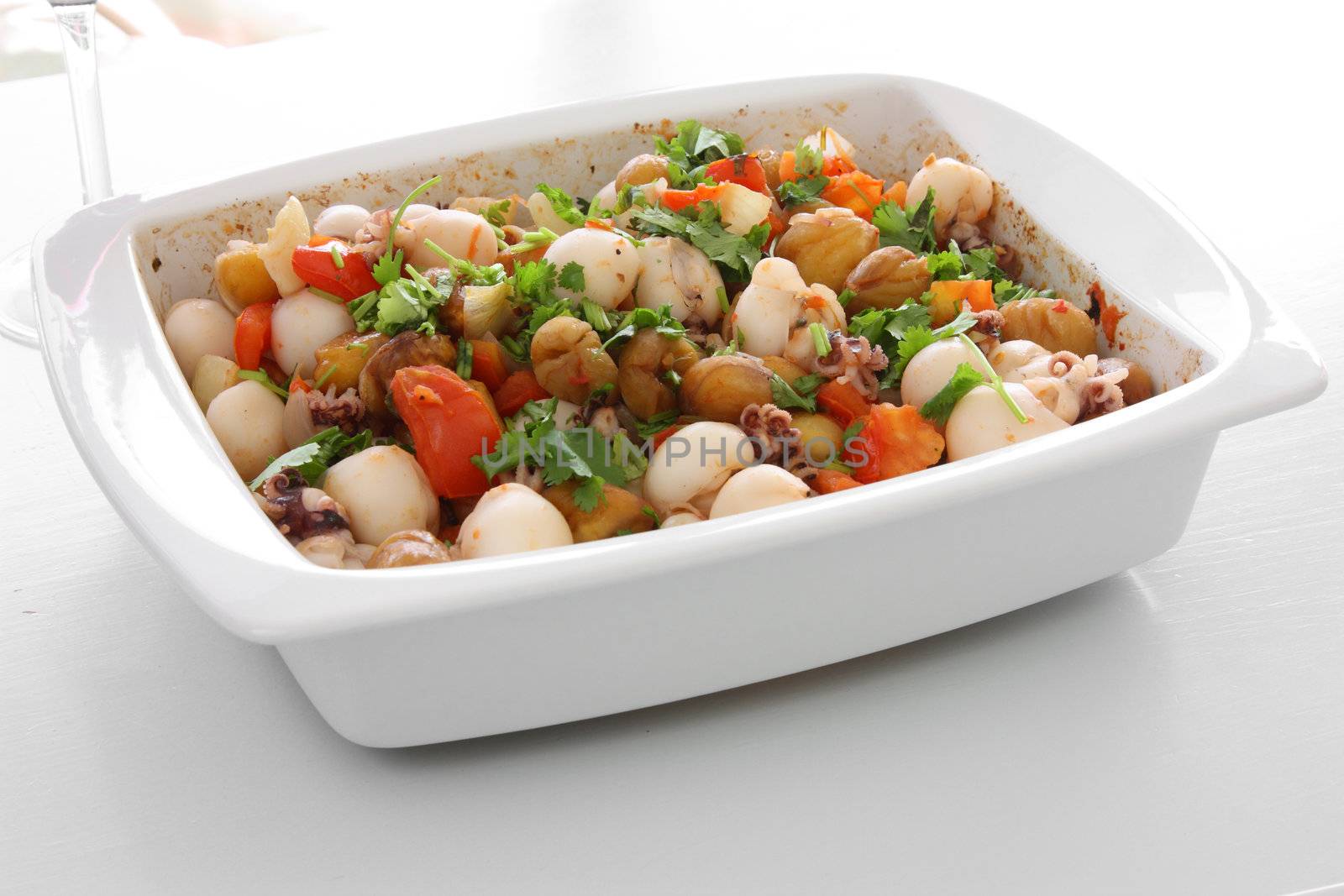 Cuttlefish dish with chestnuts and tomatoes.