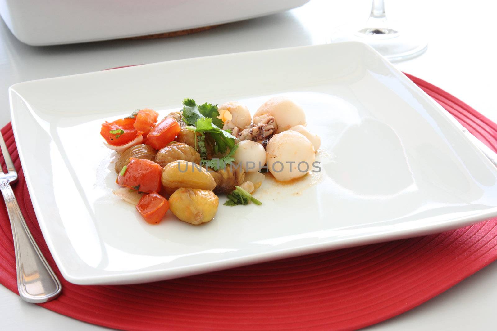 Cuttlefish dish with chestnuts and tomatoes.