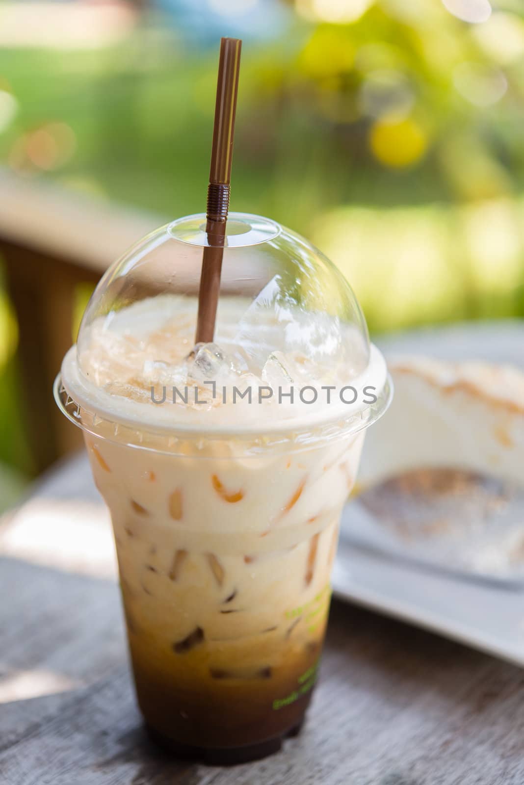 cappuchino iced coffee on table in afternoon time