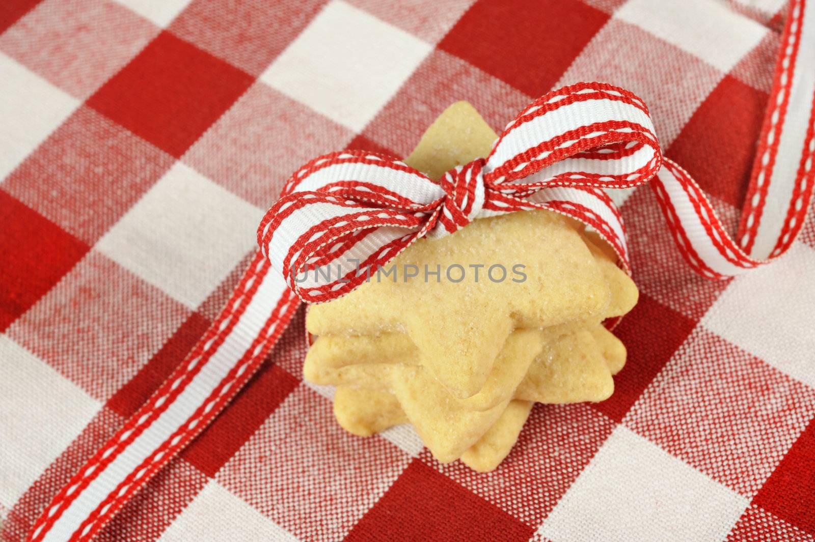 Star cookies with ribbon on  checkered cloth by tish1