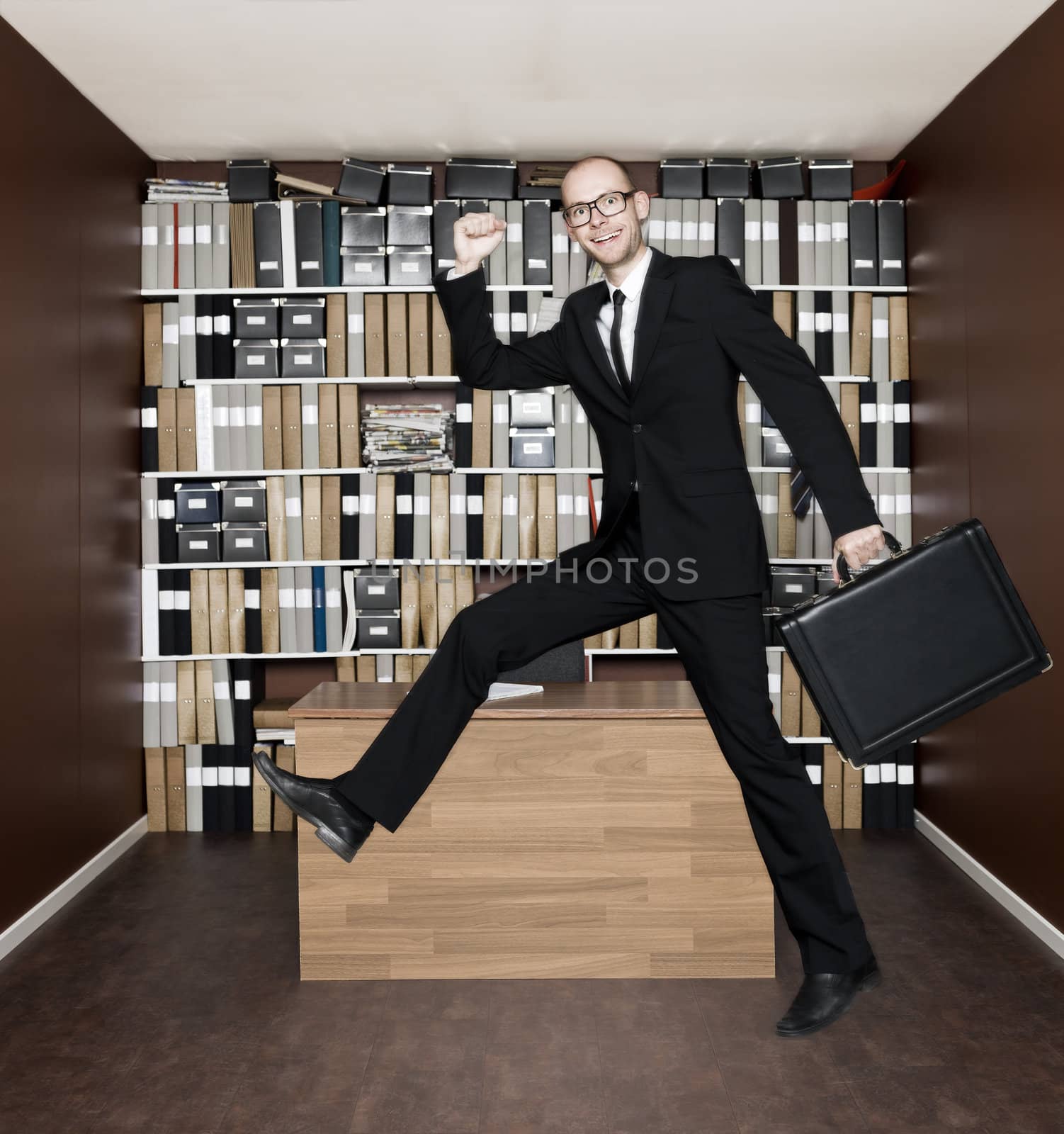 Jumping businessman in the office