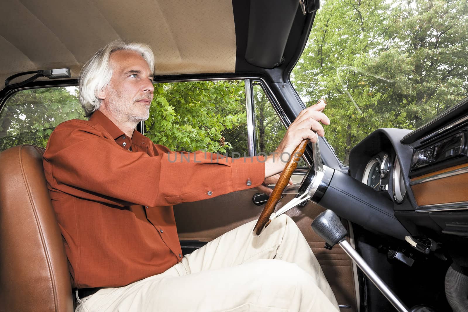 An image of a nice man in his car