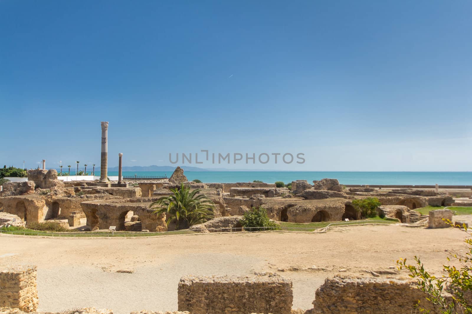 Ruins in ancient Carthage town, a UNESCO World Heritage site in Tunisia with ruins of great buildings, theaters, villas, baths, houses and columns from the great Punic and Roman empires