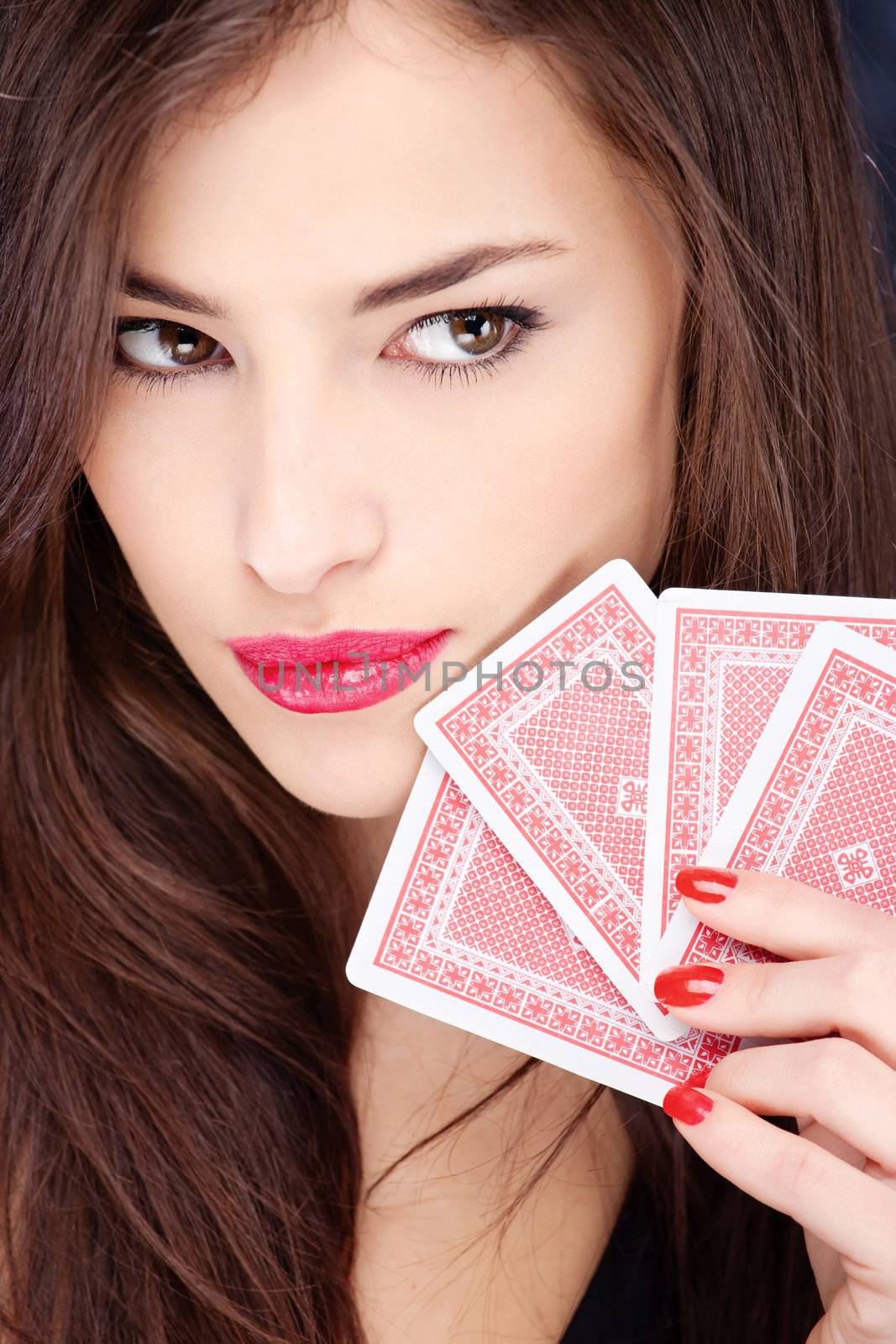 Pretty long hair woman holding gambling cards