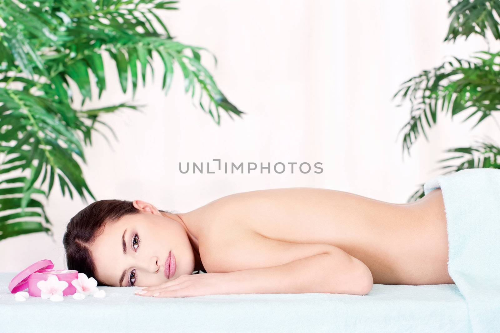 Pretty brunette woman resting after massage