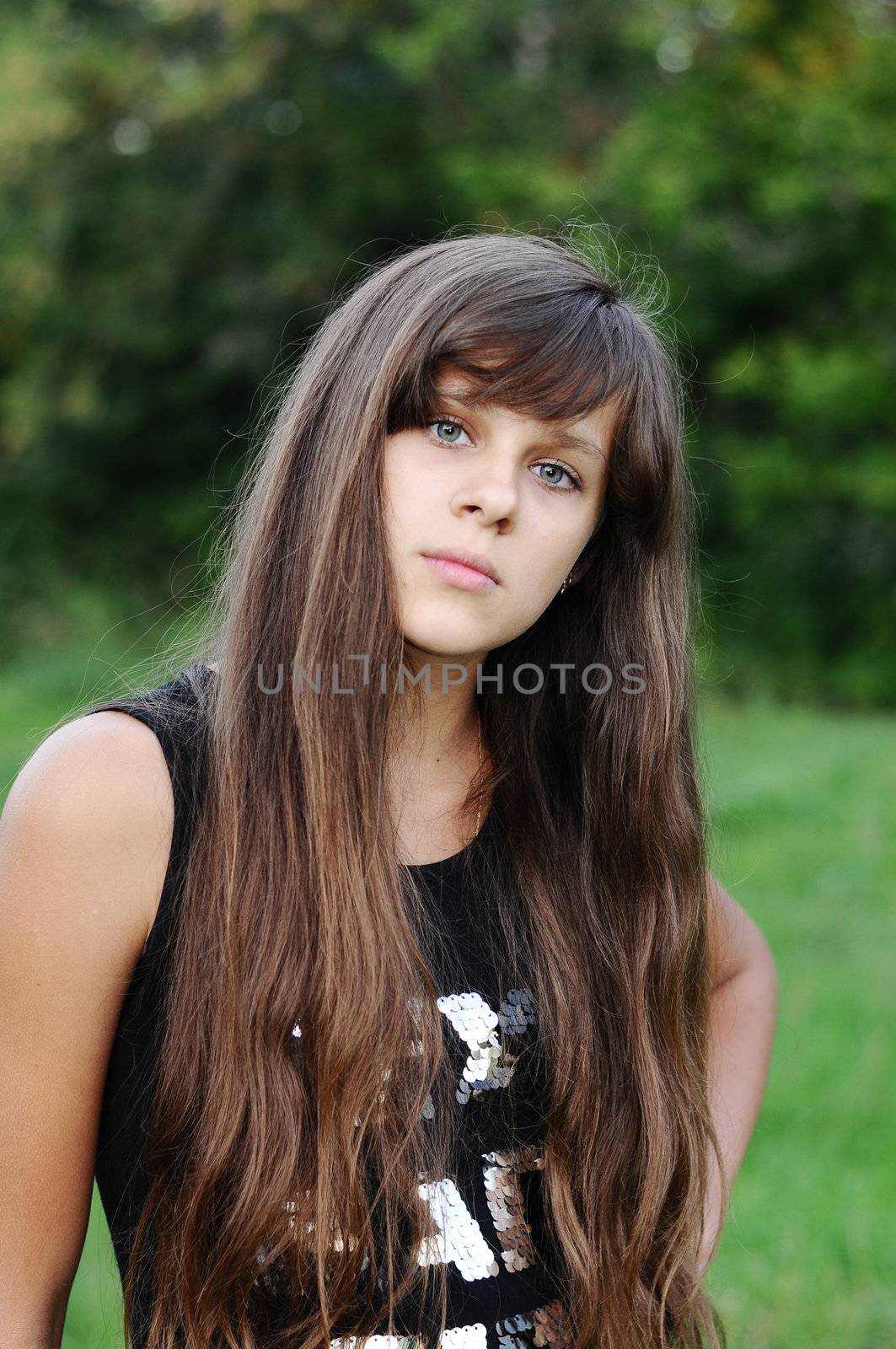 Brunette teen girl on nature by olgavolodina