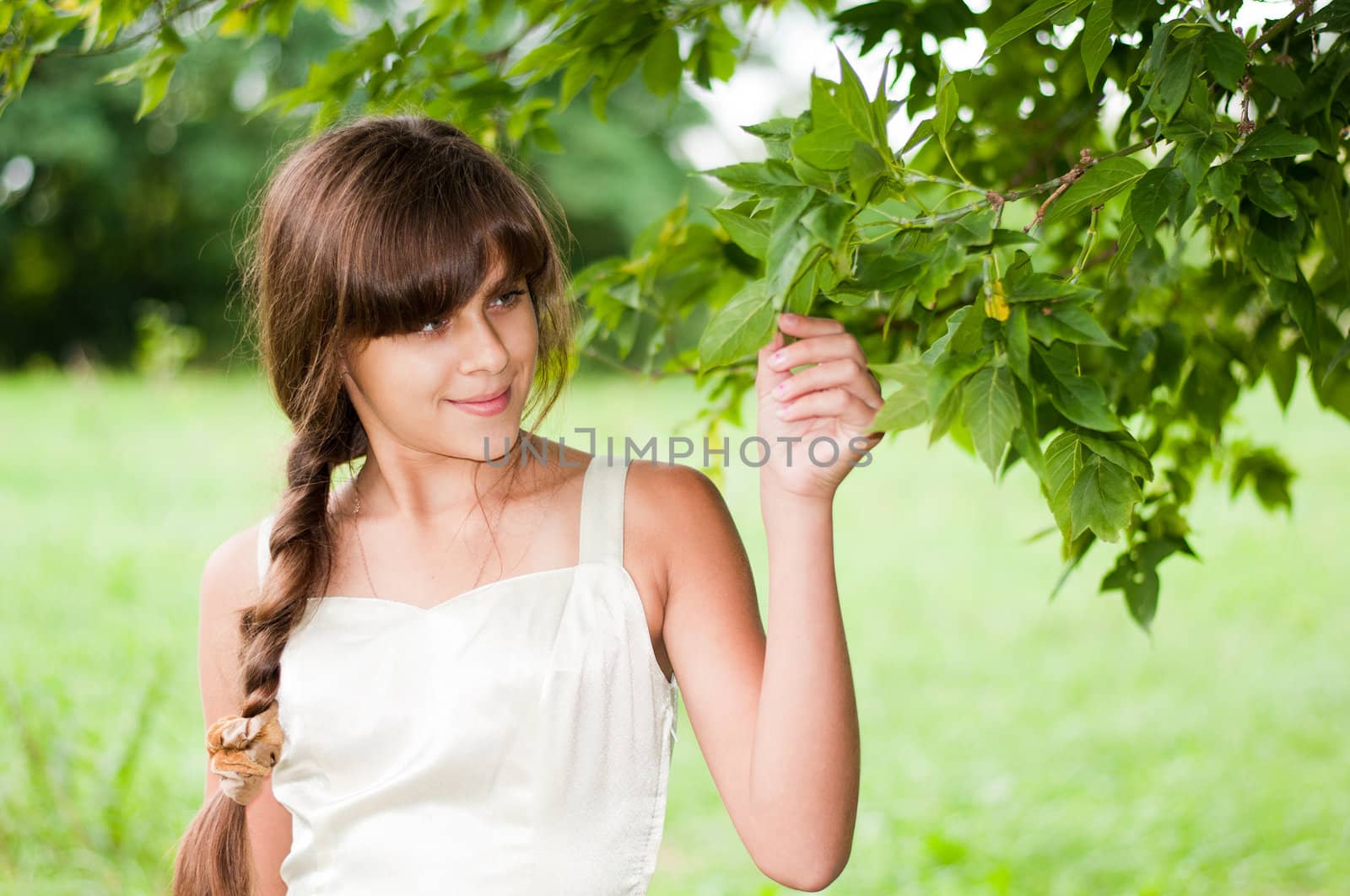 A young woman in a summer park